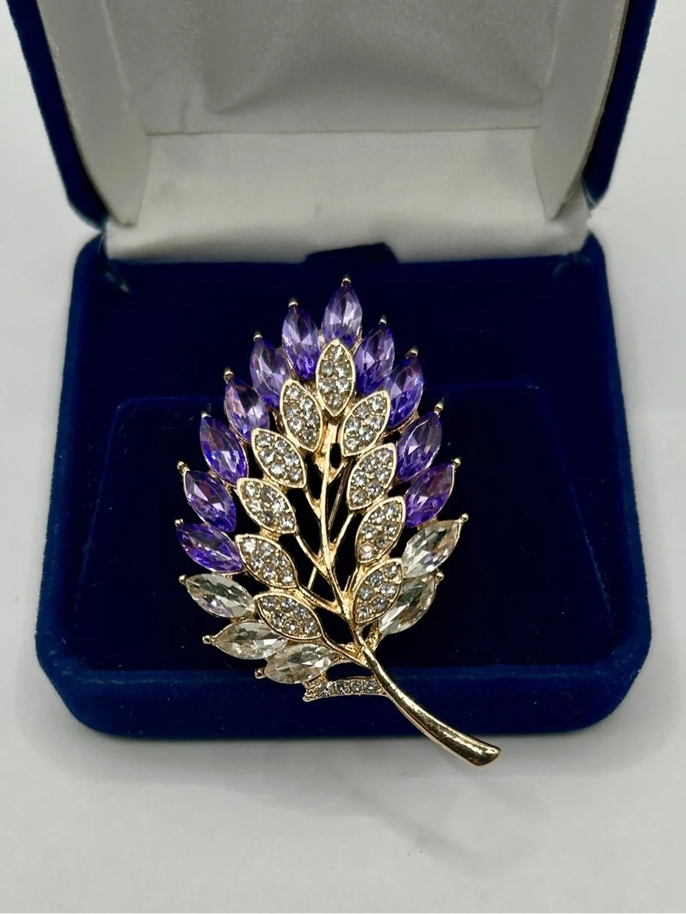 Gold Tone Leaf Brooch with Purple and Clear Faceted Glass Jewels​